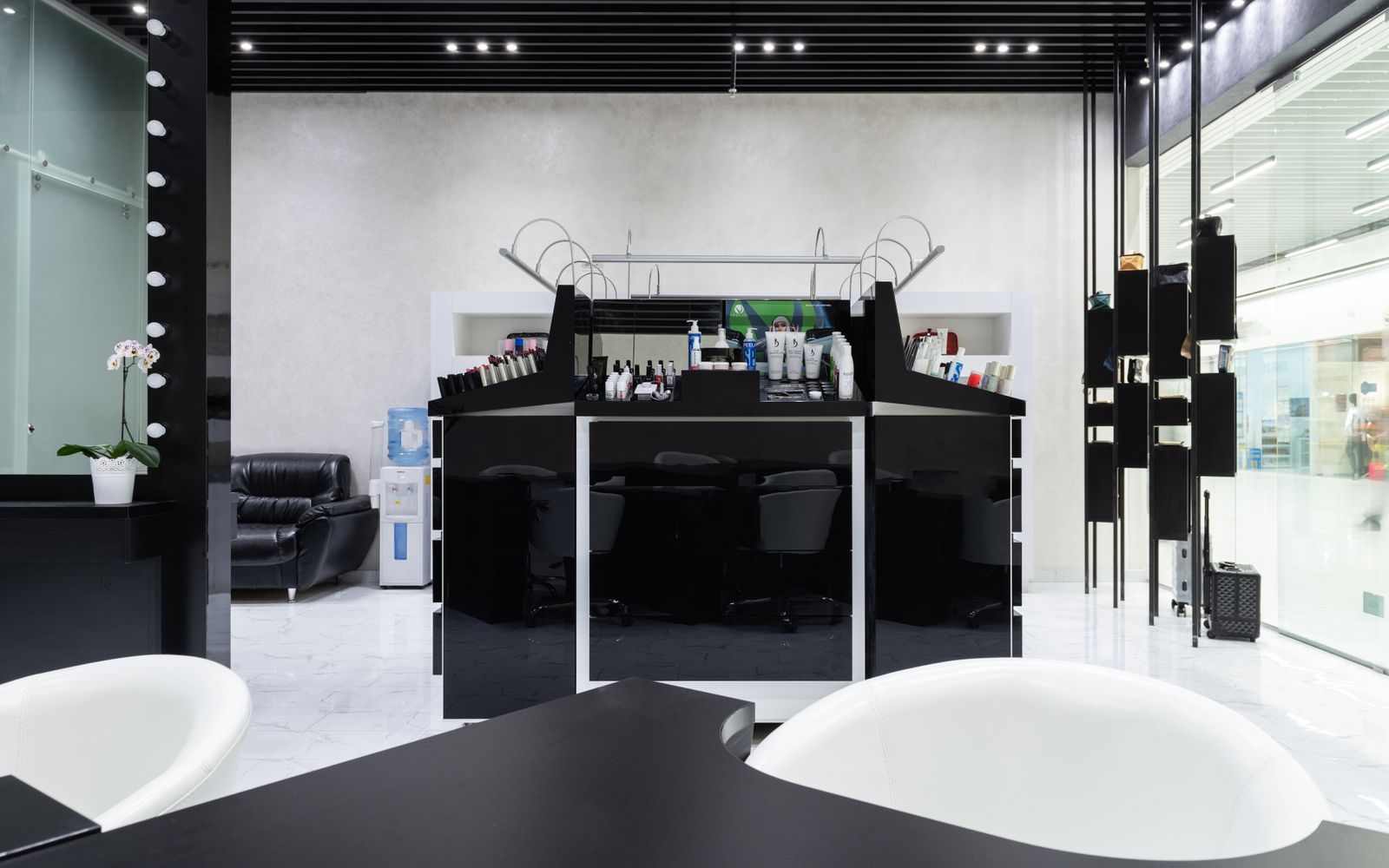The Rosewood studio interior with styling chairs and warm lighting
